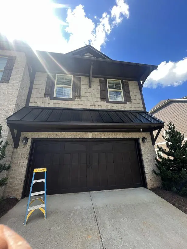 Garage door & gable — door, brackets, and gable trim — exterior painting by Vibrant Painting, Greenville SC