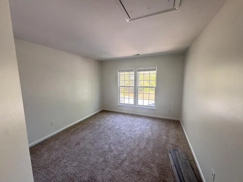 Upstairs bedroom — walls, ceiling, and trim — whole-home repaint by Vibrant Painting, Greenville SC