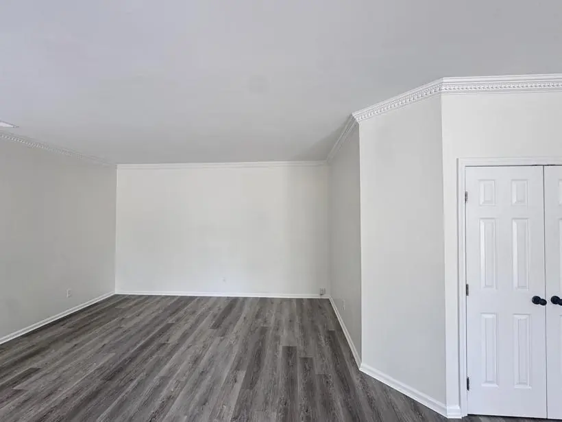 Bedroom — walls, crown, and closet doors — whole-home repaint by Vibrant Painting, Greenville SC