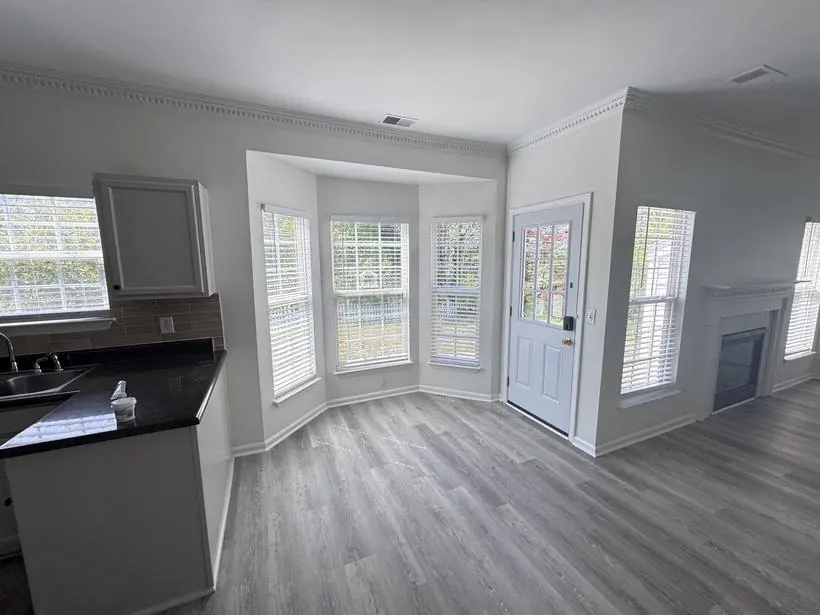 Breakfast nook — bay window, casing, and door — whole-home repaint by Vibrant Painting, Greenville SC
