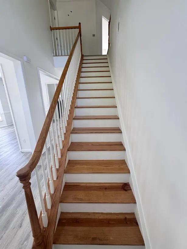 Foyer & stairs — entry walls, crown, and treads — whole-home repaint by Vibrant Painting, Greenville SC
