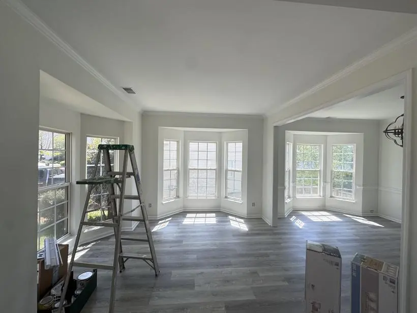 Great room — crown, baseboards, and bay windows — whole-home repaint by Vibrant Painting, Greenville SC