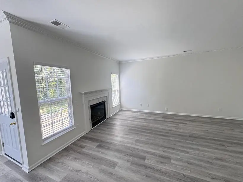 Living room — walls, crown molding & mantel — whole-home repaint by Vibrant Painting, Greenville SC