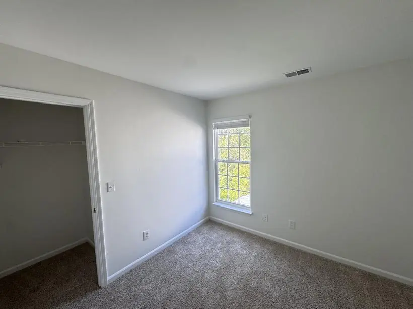Stairwell — two-story walls and rail — whole-home repaint by Vibrant Painting, Greenville SC