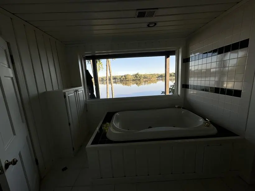 Soaking tub — surround, paneling, and trim — lakefront home repaint by Vibrant Painting, Greenville SC