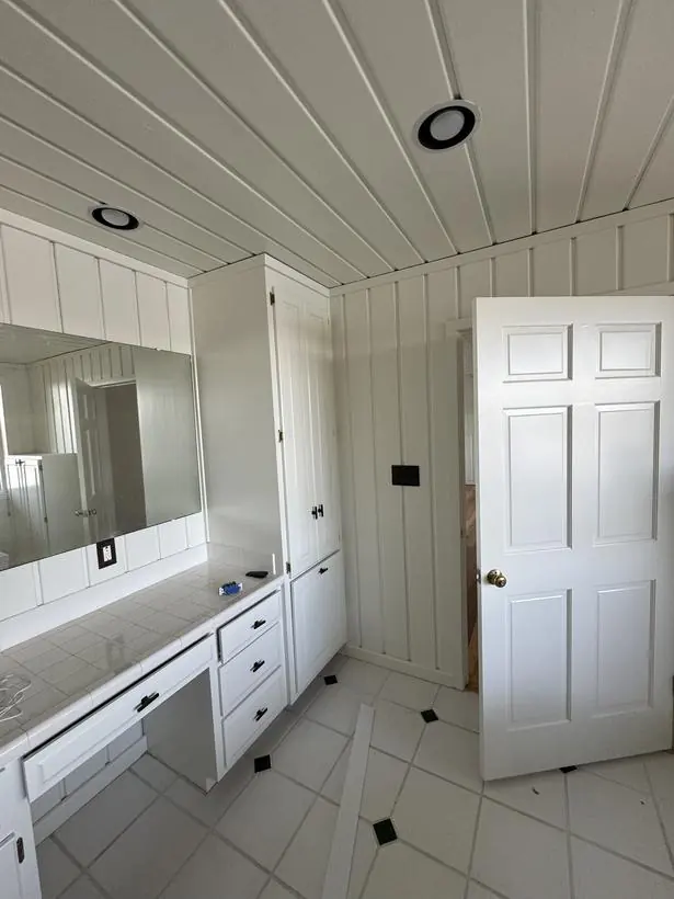 Vanity & cabinetry — cabinets, drawers, and paneling — lakefront home repaint by Vibrant Painting, Greenville SC