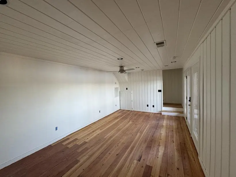 Living space — shiplap ceiling and full-height paneling — lakefront home repaint by Vibrant Painting, Greenville SC
