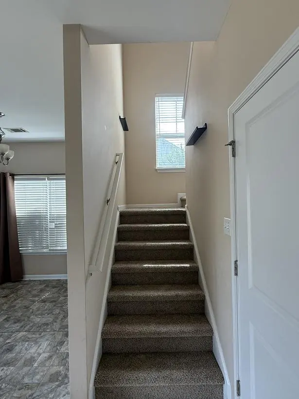 Stairwell — two-story walls and handrail — make-ready turnover by Vibrant Painting, Greenville SC