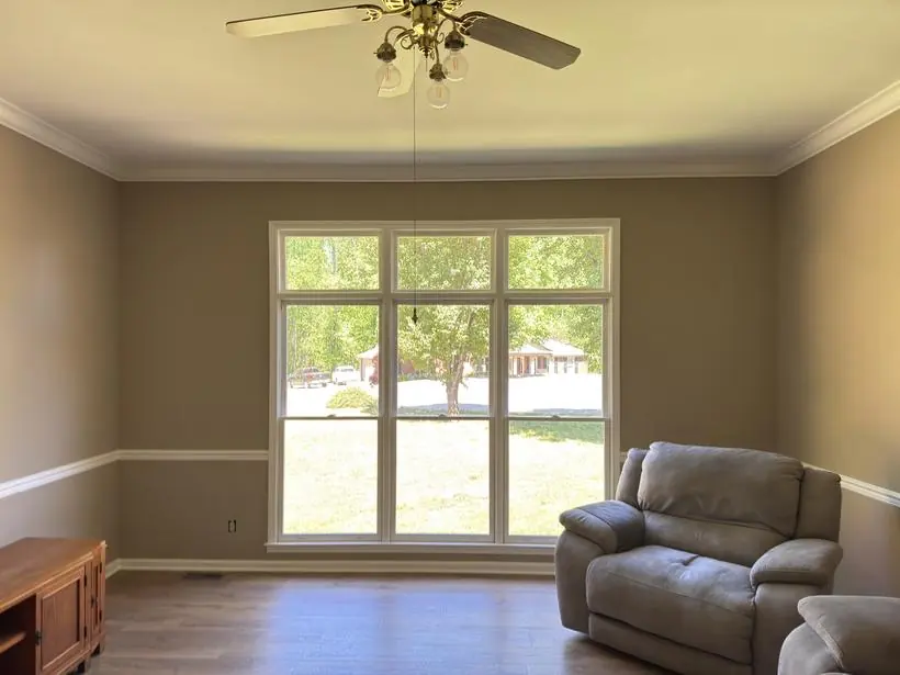 Living room — walls, ceiling, crown & casing — interior repaint by Vibrant Painting, Greenville SC
